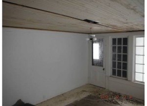 Here's what our sunroom looked like before the demolition began.  Flat, sagging ceiling.